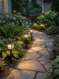 GOODNEST PATH solar pathway light lighting a garden walkway at dusk
