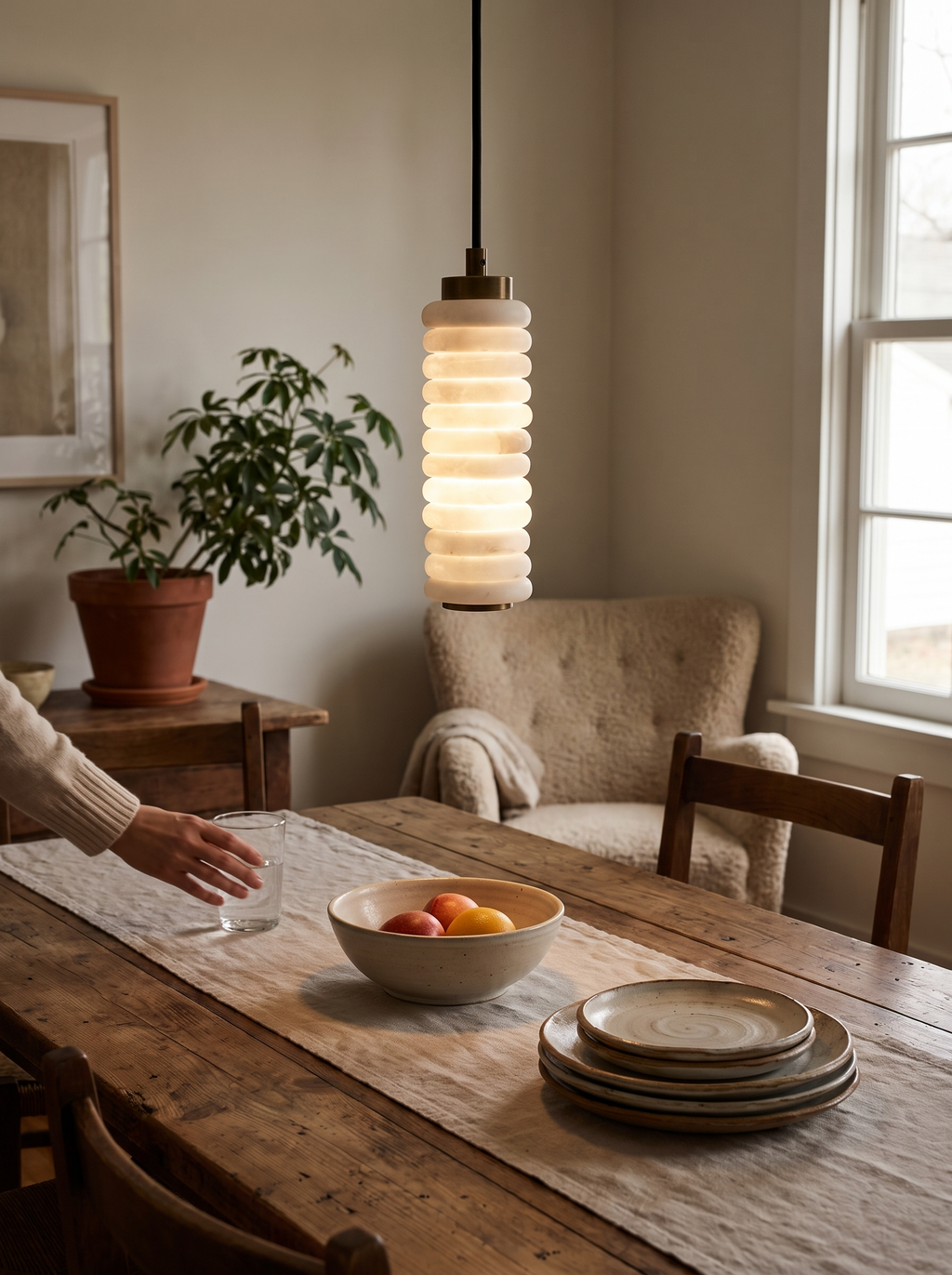 GOODNEST HALO stacked alabaster ring pendant catching the light
