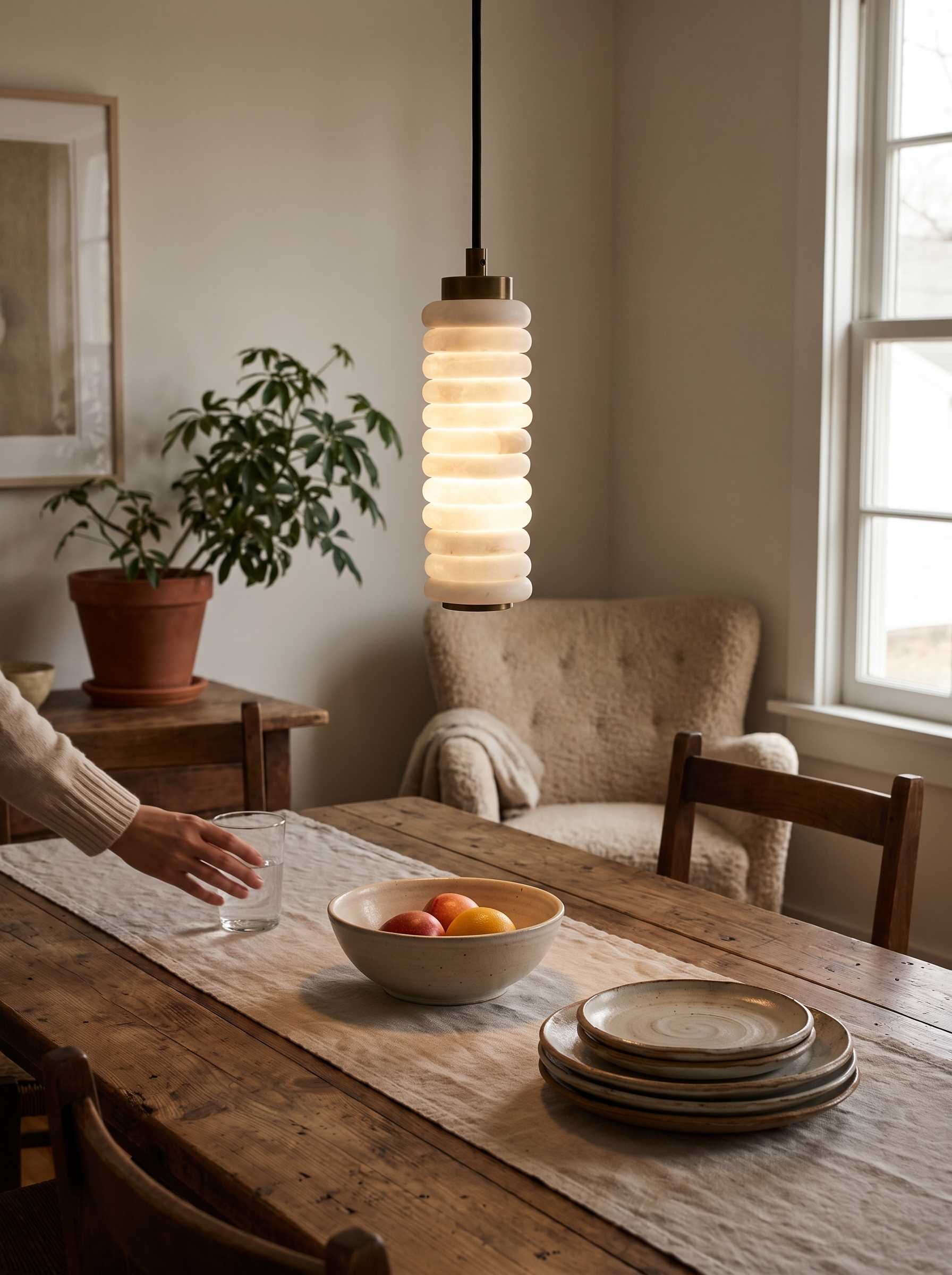 GOODNEST HALO stacked alabaster ring pendant catching the light