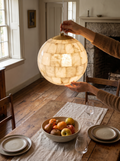 GOODNEST ORB alabaster globe pendant assembled from stone sections