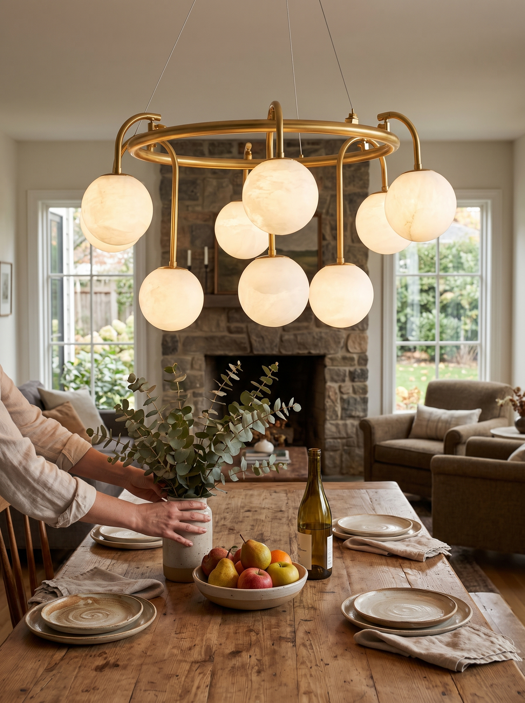 GOODNEST ATRIUM alabaster globe ring chandelier above a dining table