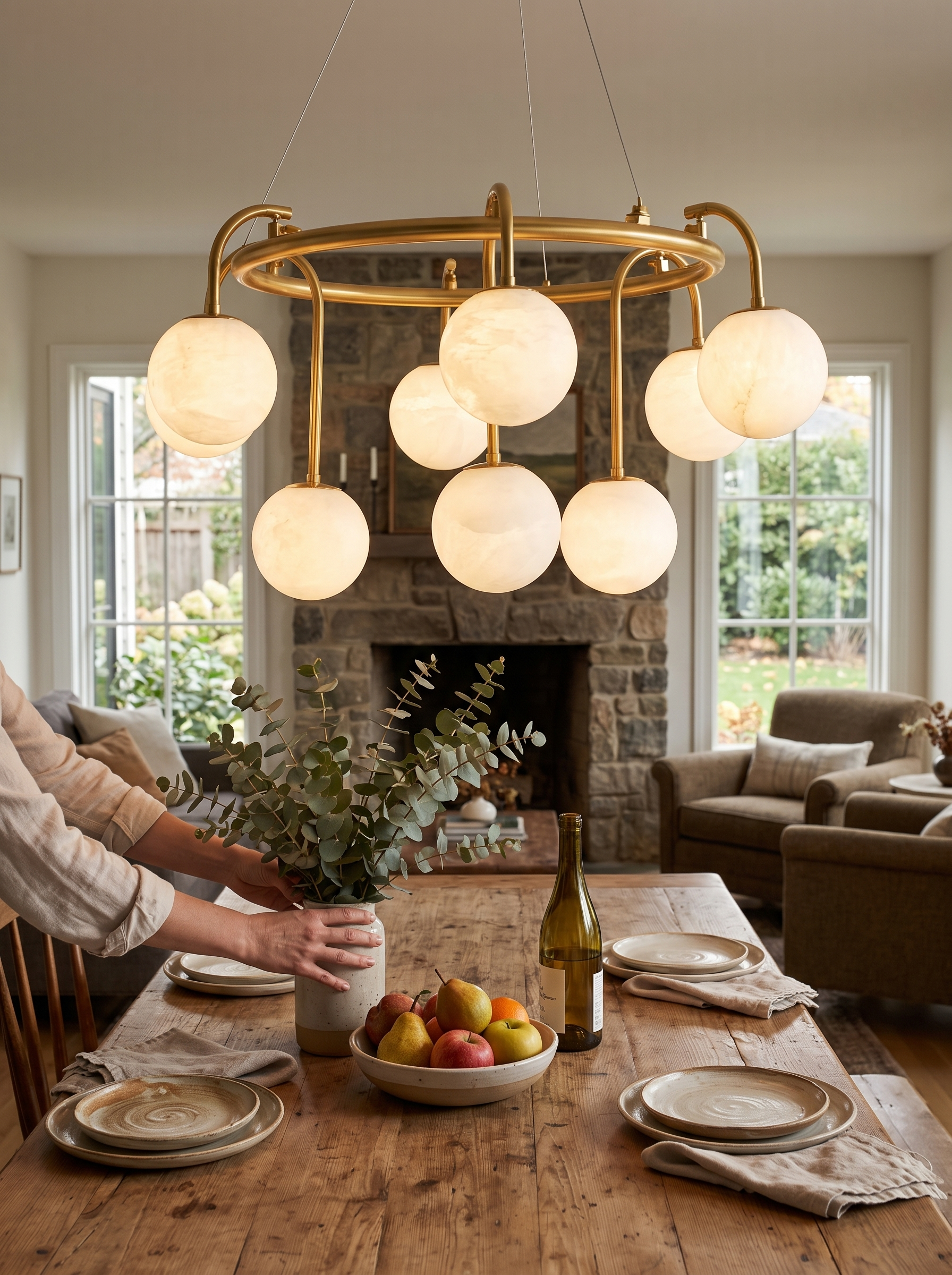 GOODNEST ATRIUM alabaster globe ring chandelier above a dining table