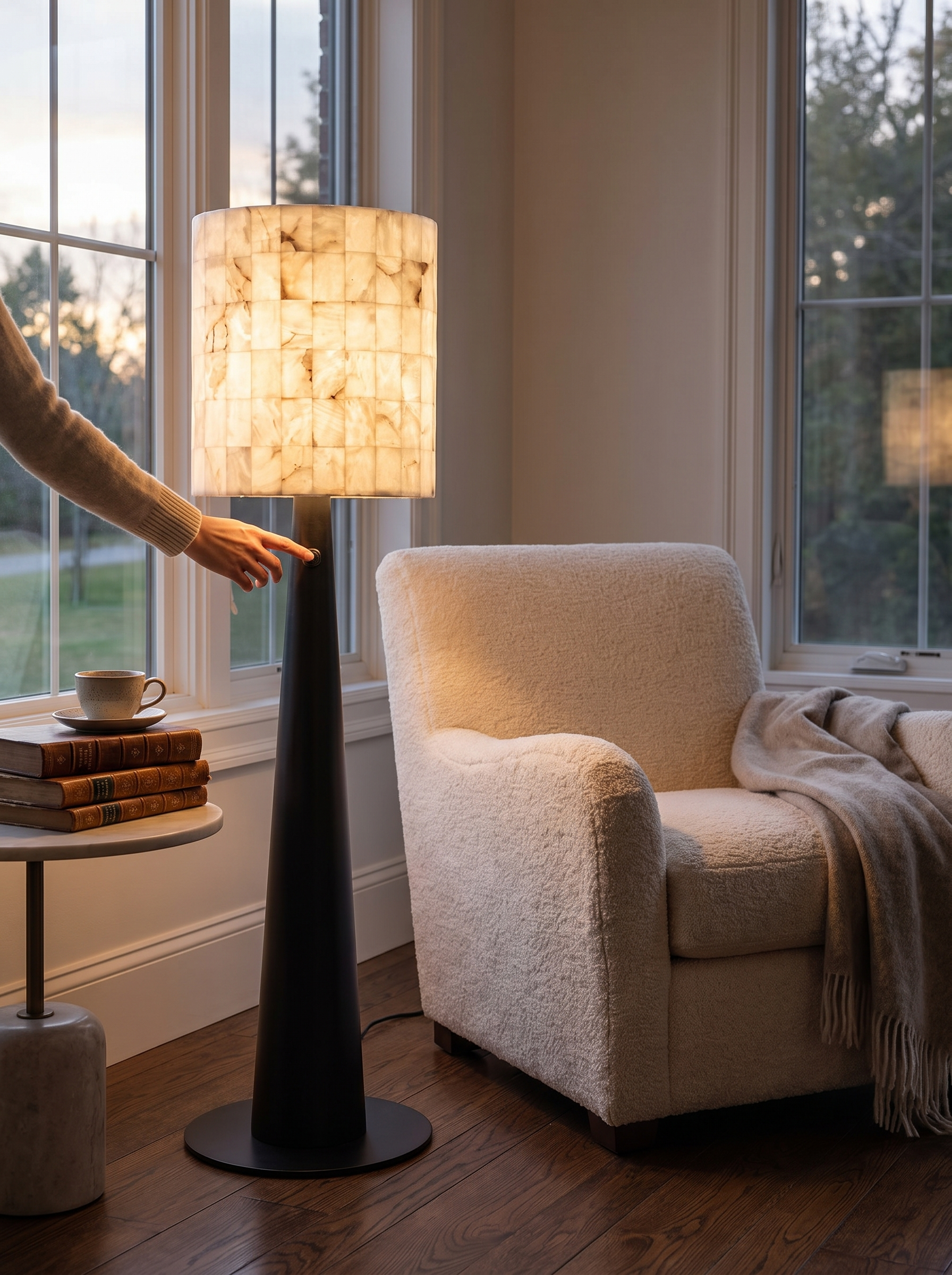 GOODNEST STRATA slim floor lamp beside a reading chair