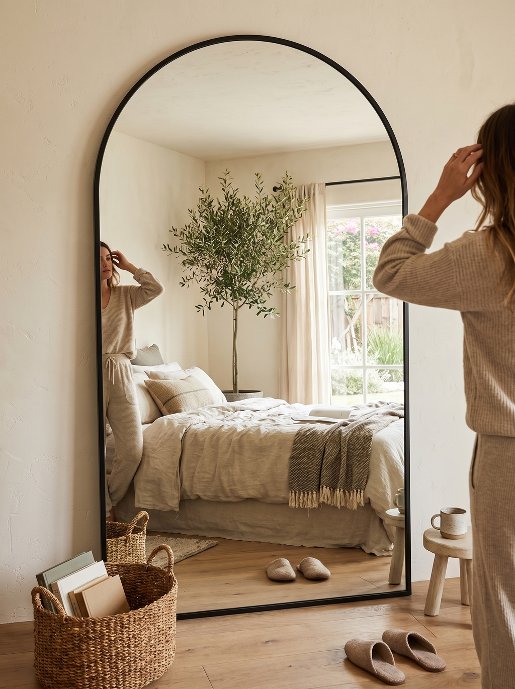GOODNEST MONOLITH six foot arch mirror against a wall